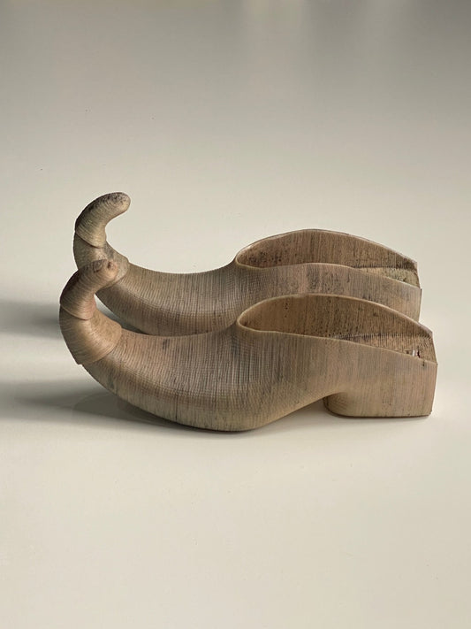 Curled toe mules in Bone